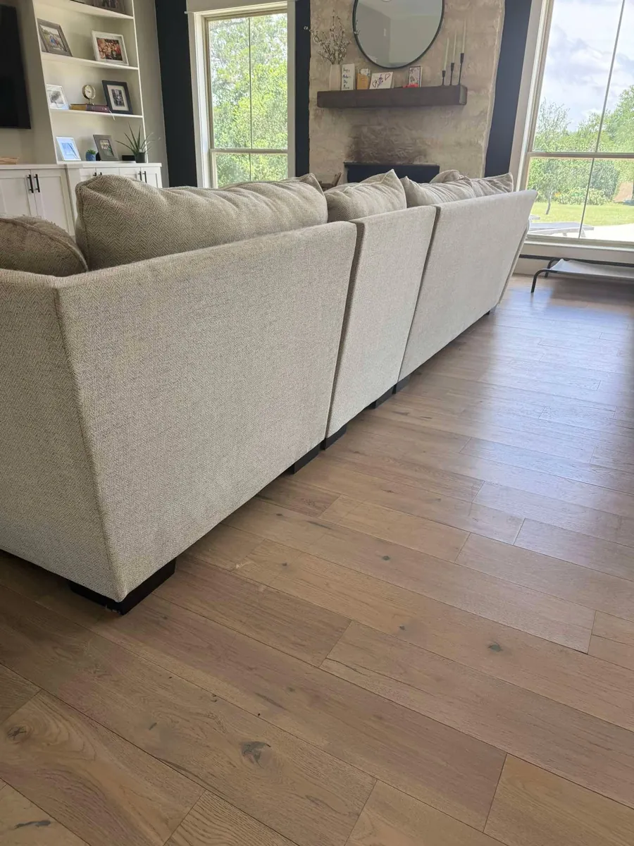 Cream fabric sectional sofa after professional sofa cleaning in Weeki Wachee, FL by Empire DLC Cleanings