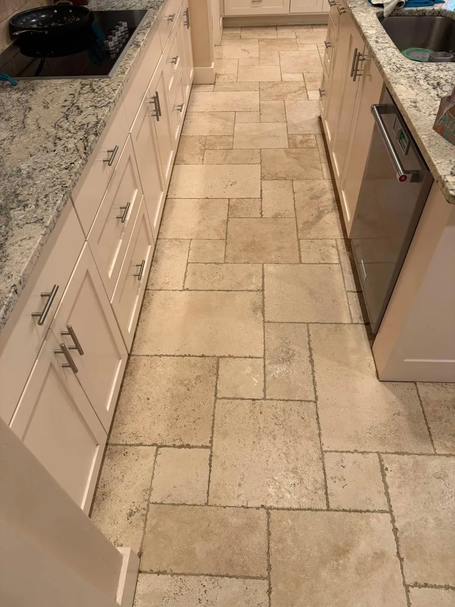 Travertine kitchen floor tile and grout cleaning in Spring Hill, FL by Empire DLC Cleanings